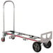 A silver Magliner convertible hand truck with black wheels and a red handle.