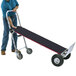 A man using a Magliner Gemini XL convertible hand truck with pneumatic wheels and a U-loop handle.