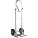 A silver Magliner hand truck with black wheels and a vertical loop handle.