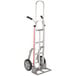 A silver Magliner hand truck with balloon wheels and dual handles.