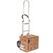 A Magliner hand truck with a cardboard box on it.