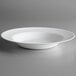 An Arcoroc white opal glass pasta plate on a white surface.