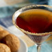 A martini glass filled with brown liquid with a DaVinci Gourmet Sugar Free Gingerbread Flavoring Syrup brown sugar rim.