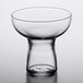 A clear Libbey cocktail glass with a short base on a table.
