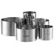A set of five Ateco stainless steel round ring molds.