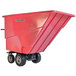 A red Magliner motorized hopper cart with dual handle bars and foam filled wheels.