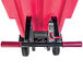 A red and black Magliner motorized self dumping hopper with dual handle bars.