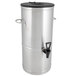 A stainless steel Bloomfield 5 gallon iced tea dispenser with a black lid and spigot.