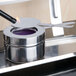 A Vollrath stainless steel chafer fuel holder with a flame in it.