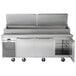 A stainless steel Traulsen 90" salad and pizza prep refrigerator with three doors.