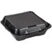 A black Genpak foam container with 3 compartments and a hinged lid.