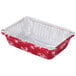 A red and white rectangular foil tray with snowflake designs on the lid.