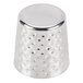 A close up of a textured stainless steel cup with a silver metal knob.
