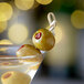 A Belosa martini with Chipotle Pepper Stuffed Queen Olives on a stick.