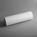 A Choice roll of white butcher paper on a gray surface.