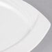 A close up of a CAC Garden State bone white square porcelain plate.