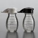 Two Tablecraft glass beehive shakers with black and white lids.