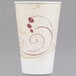 A Solo wax treated paper cold cup with red and gold swirl designs.