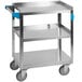A stainless steel Carlisle utility cart with blue handles.