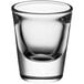 A close up of a clear Acopa shot glass.
