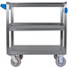 A Carlisle stainless steel utility cart with three shelves and blue wheels.
