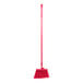 A red Carlisle Sparta Duo-Sweep broom with a long handle.