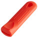 A red removable silicone sleeve for a pan handle.
