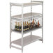 A white metal Cambro Camshelving® security shelf with bottles on it.