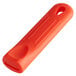 A red Choice silicone pan handle sleeve.