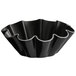 A black fluted pan with a ruffled edge.