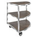 An Eastern Tabletop metal and wood serving cart with three reversible shelves.