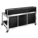 A black and silver Eastern Tabletop foldaway bar cart on a counter.