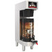 A Grindmaster PrecisionBrew automatic coffee brewer with a vacuum shuttle of coffee on top.