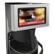 A Grindmaster PrecisionBrew automatic coffee maker with a screen on the front.