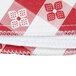 A close-up of a red and white gingham vinyl table cover.