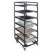 A black coated steel Eastern Tabletop storage cart with trays on it.