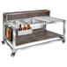 An Eastern Tabletop white textured laminate foldaway bar cart with bottles on it.