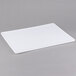 A white rectangular Winholt plastic proofing board on a gray surface.