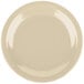 A tan Carlisle melamine plate with a white rim.