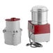 A Robot Coupe commercial food processor with a lid on a small container.