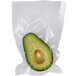 A Breville 6" x 10" Cook-In Heat Seal Chamber vacuum bag with an avocado inside.