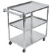 A Vollrath stainless steel utility cart with three shelves and wheels.