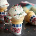 A JOY ice cream cone with a scoop of ice cream and sprinkles.