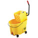 A yellow Rubbermaid mop bucket with a handle and a side press wringer.