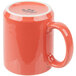 A close-up of a red Tuxton C-Handle mug.