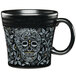 A black Fiesta mug with a skull design on it.