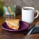 A slice of pie on a Fiesta® Mulberry appetizer plate next to a cup of coffee.