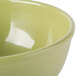A sage green Cal-Mil melamine bowl.