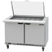 A Beverage-Air stainless steel sandwich prep table with 4 drawers and clear lids.