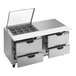 A Beverage-Air stainless steel refrigerated sandwich prep table with clear lids open on a counter with drawers.